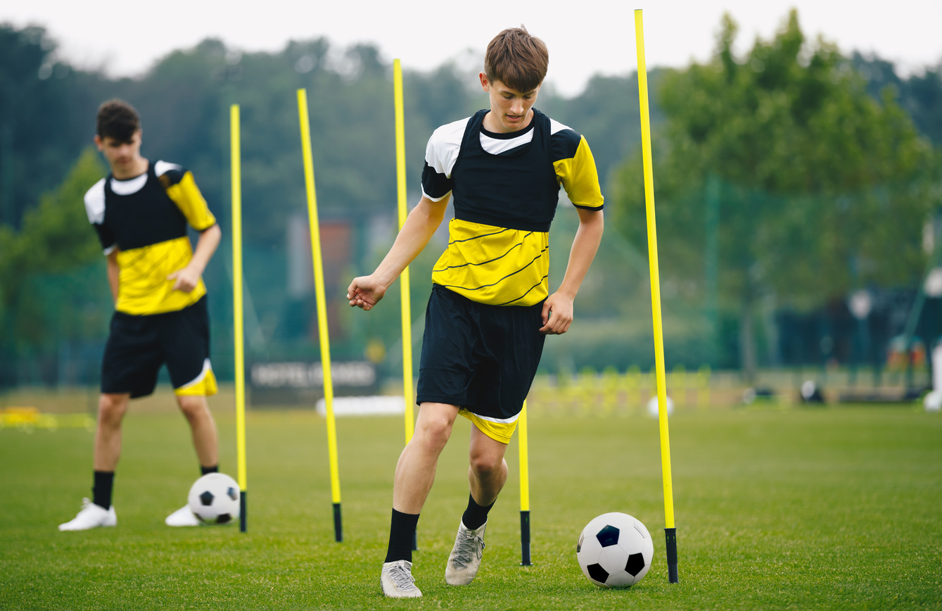 Young Athletes Training with Agility Poles 